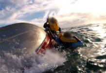 Men winched from ocean after boat capsizes